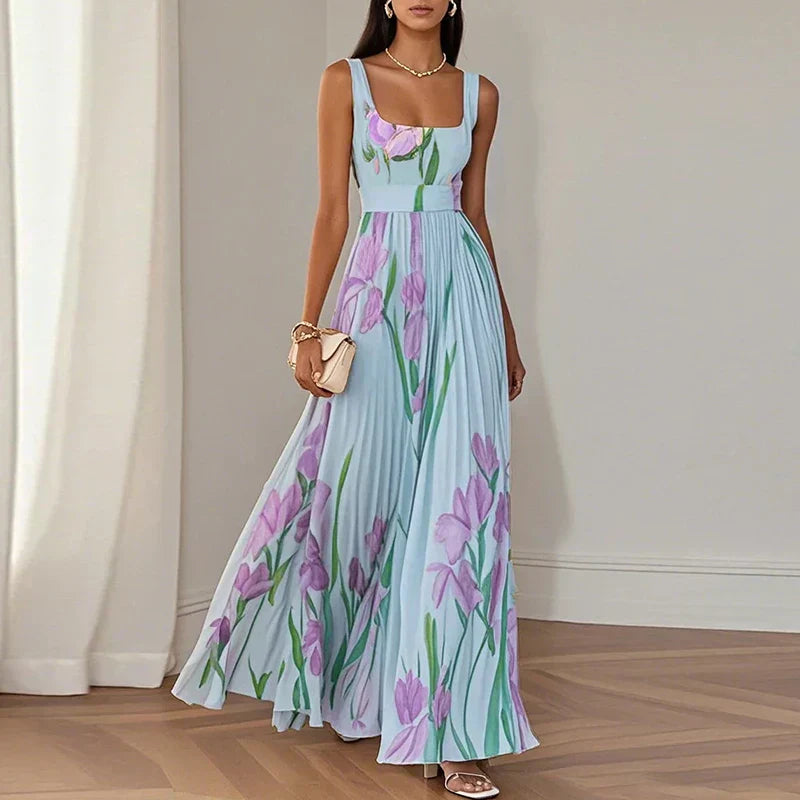 LYRA | Elegante vestido largo de flores con una silueta plisada muy favorecedora